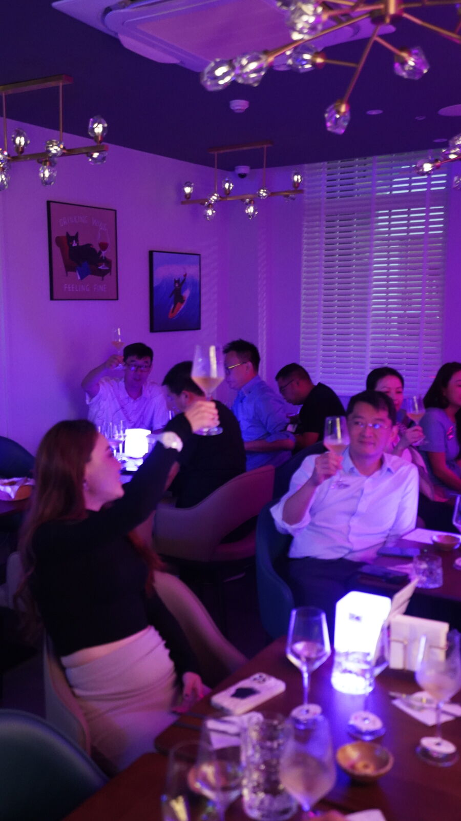 Guests raising glasses in a team toast