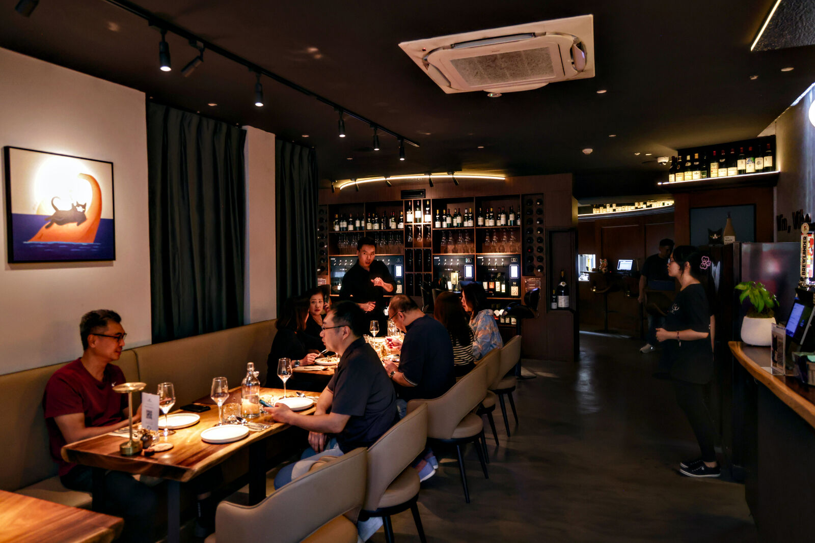 Vinflow's warmly lit wine bar in the evening